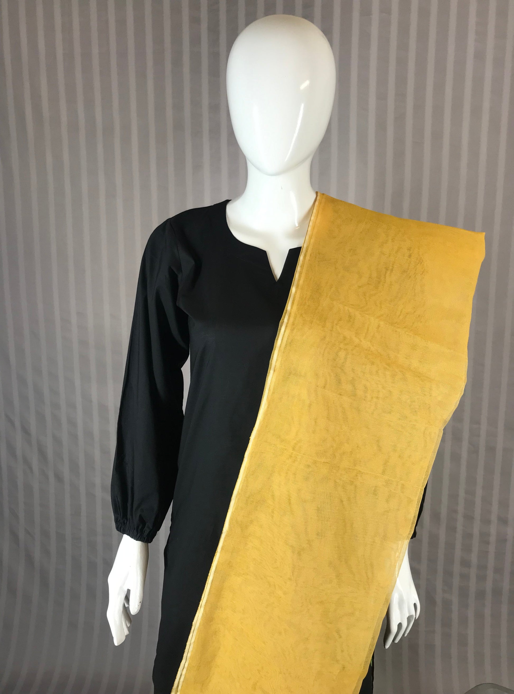 Beige khaddi net dupatta with handwoven texture, styled with festive kurta