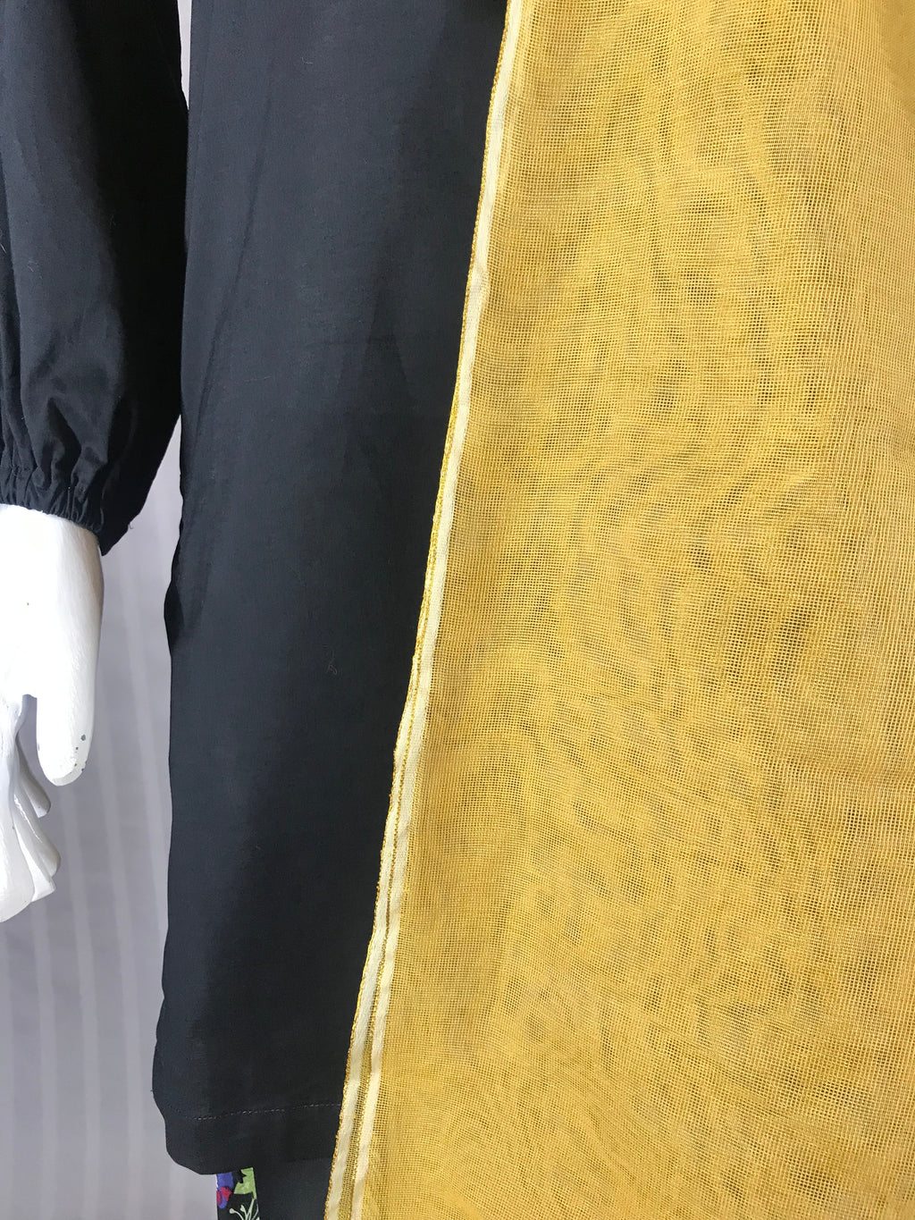 Light almond colored luxury dupatta folded on neutral surface