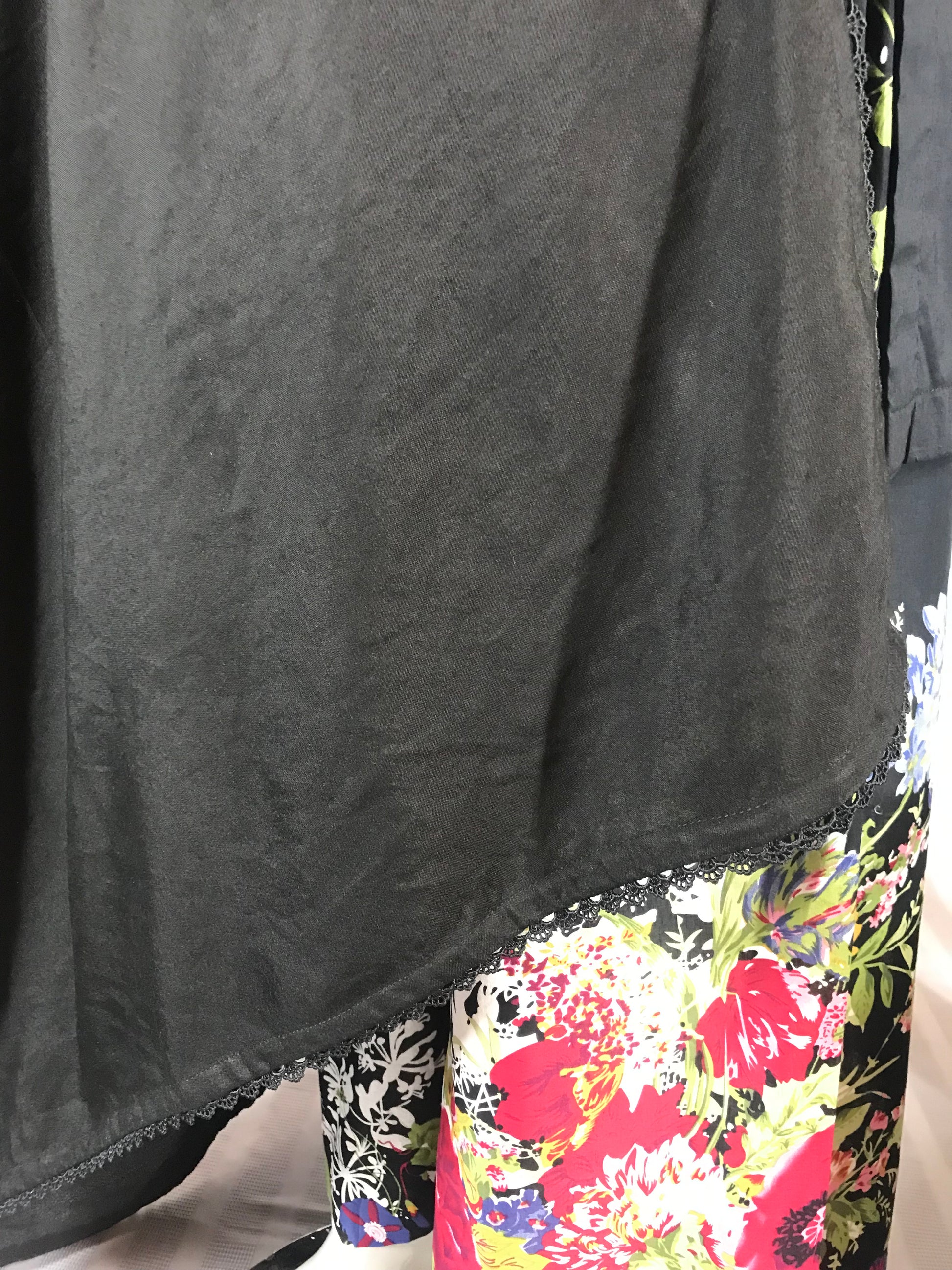 Elegant sheer black wrap draped with pleats